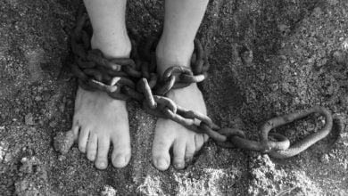 Two feet that are held in captivity showing us how to overcome sin and free us from slavery